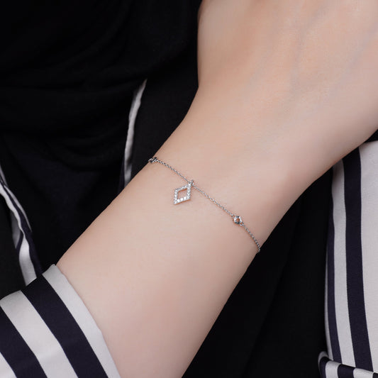 18k white gold bracelet with rhombus shape dangling decorated with natural diamond stones | Trendy collection