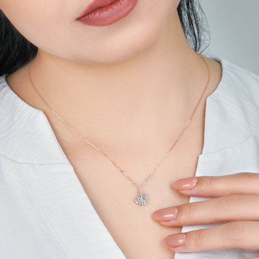 18K WHITE AND ROSE GOLD NECKLACE HEART SHAPE DECORATED WITH BAGUETTE, ROUND BRILLIANT - CUT NATURAL DIAMOND STONES