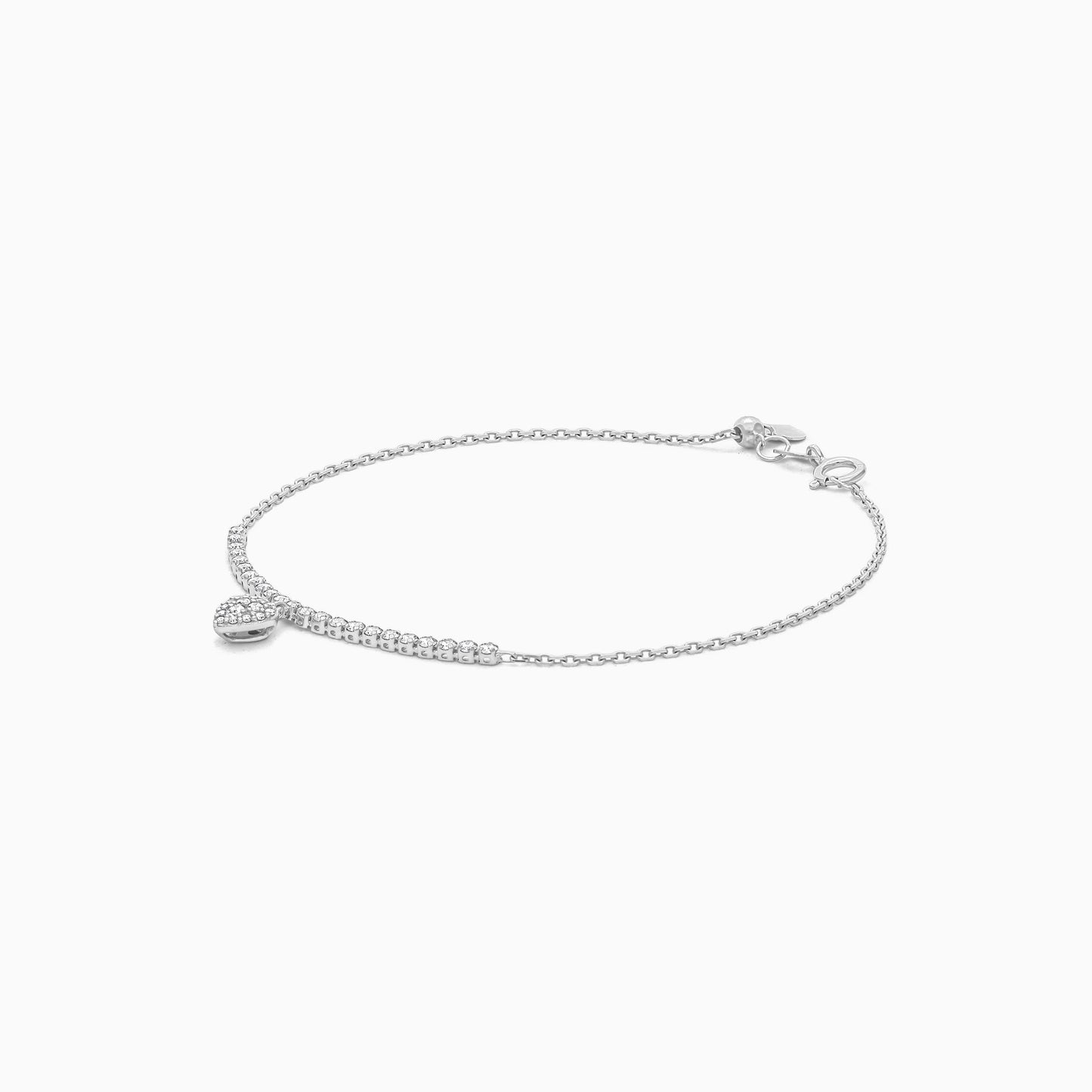 18k white gold adjustable bracelet with a dangling heart-shaped pendant decorated with natural diamond stones | Trendy collection