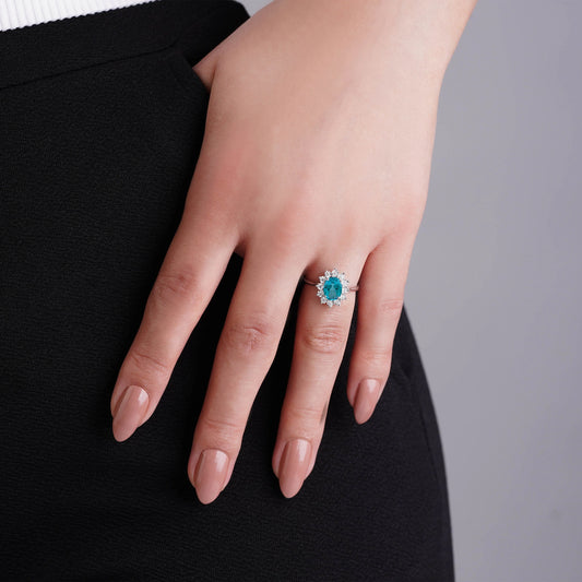 18K white gold ring decorated with natural Swiss blue Topaz stone surrounded by natural diamond stones