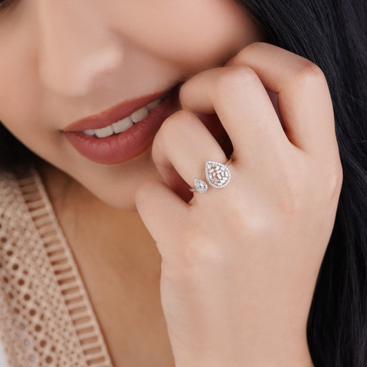 18K WHITE GOLD DROP SHAPE RING DECORATED WITH NATURAL DIAMOND BAGUETTE STONES