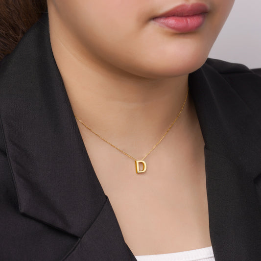18k yellow gold necklace with letter “D” decorated with single natural diamond stone from Alpha collection