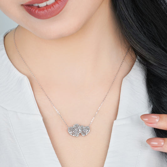 18K WHITE GOLD NECKLACE WITH 2 HEART DECORATED WITH NATURAL DIAMOND TAPERED BAGUETTE SHAPE