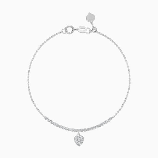 18k white gold adjustable bracelet with a dangling heart-shaped pendant decorated with natural diamond stones | Trendy collection