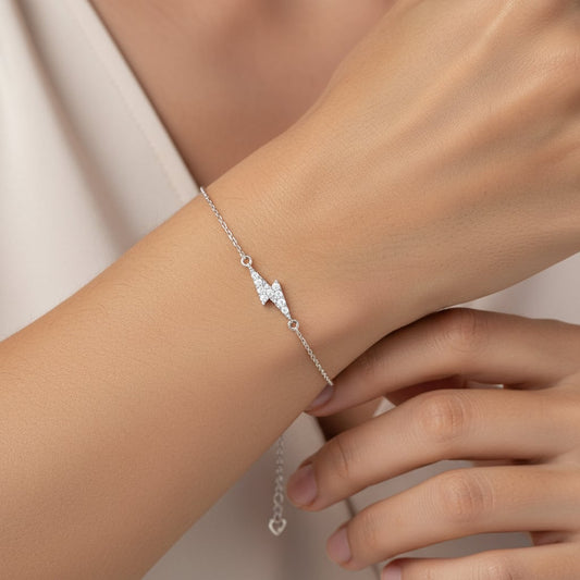 18k white gold adjustable bracelet shaped by Lightning Bolt decorated with natural diamond stones | Trendy collection
