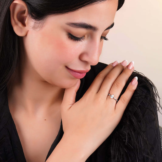 18k white gold solitaire ring with a single pear shaped natural diamond