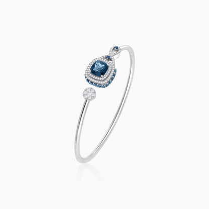 18K White Gold bangle featuring a stunning Natural Diamond and London blue Topaz stones