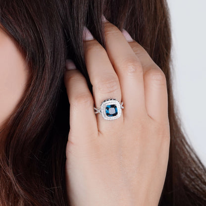 18K White Gold Ring featuring a stunning Natural Diamond and London Blue Topaz stones