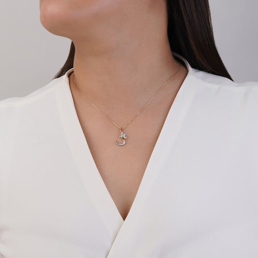 18k Yellow Gold 'Seen' Arabic Letter Necklace decorated with natural diamond and blue topaz stones