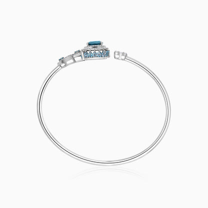 18K White Gold bangle featuring a stunning Natural Diamond and London blue Topaz stones