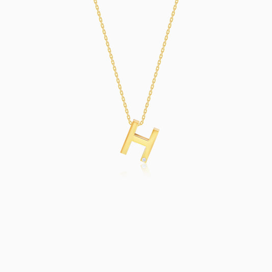 18k yellow gold necklace with letter “H” decorated with single  natural diamond stone from Alpha collection