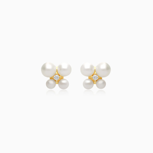 18k yellow gold pair of earrings decorated by a single zircon stone in the centre surrounded by different sizes of pearls