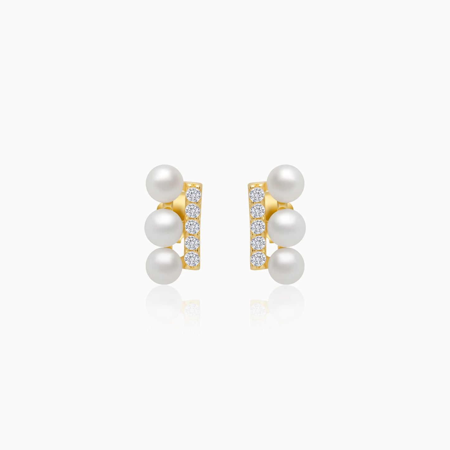 18k yellow gold earrings features 3 pearls aligning with zircon stones