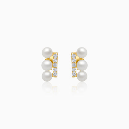 18k yellow gold earrings features 3 pearls aligning with zircon stones