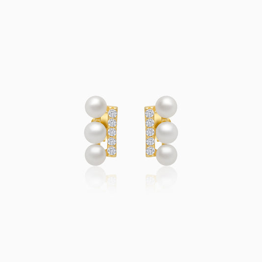 18k yellow gold earrings features 3 pearls aligning with zircon stones