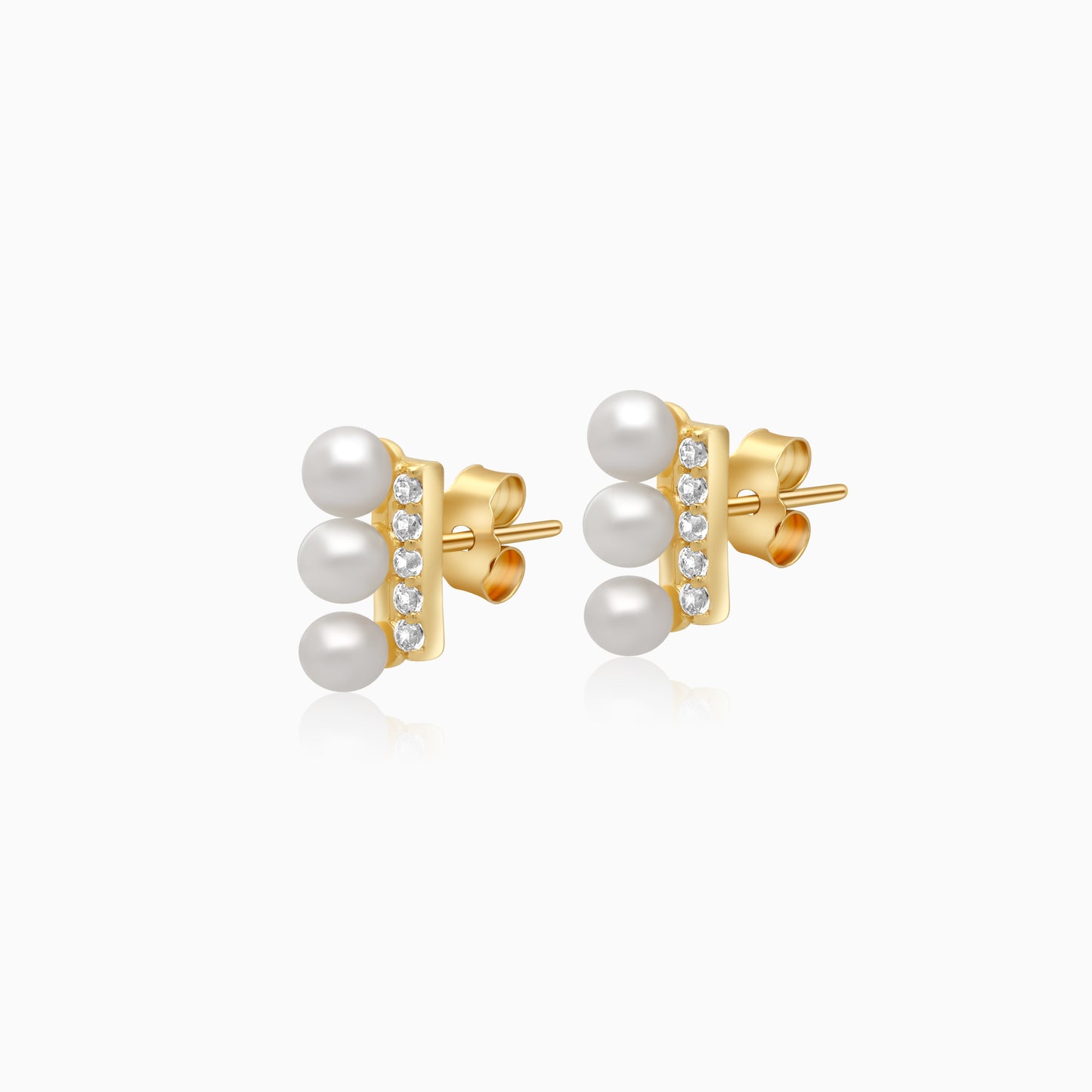 18k yellow gold earrings features 3 pearls aligning with zircon stones