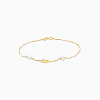 18K Yellow Gold Infinity-Shaped Bracelet with Diamonds and White Pearls – Danah Collection