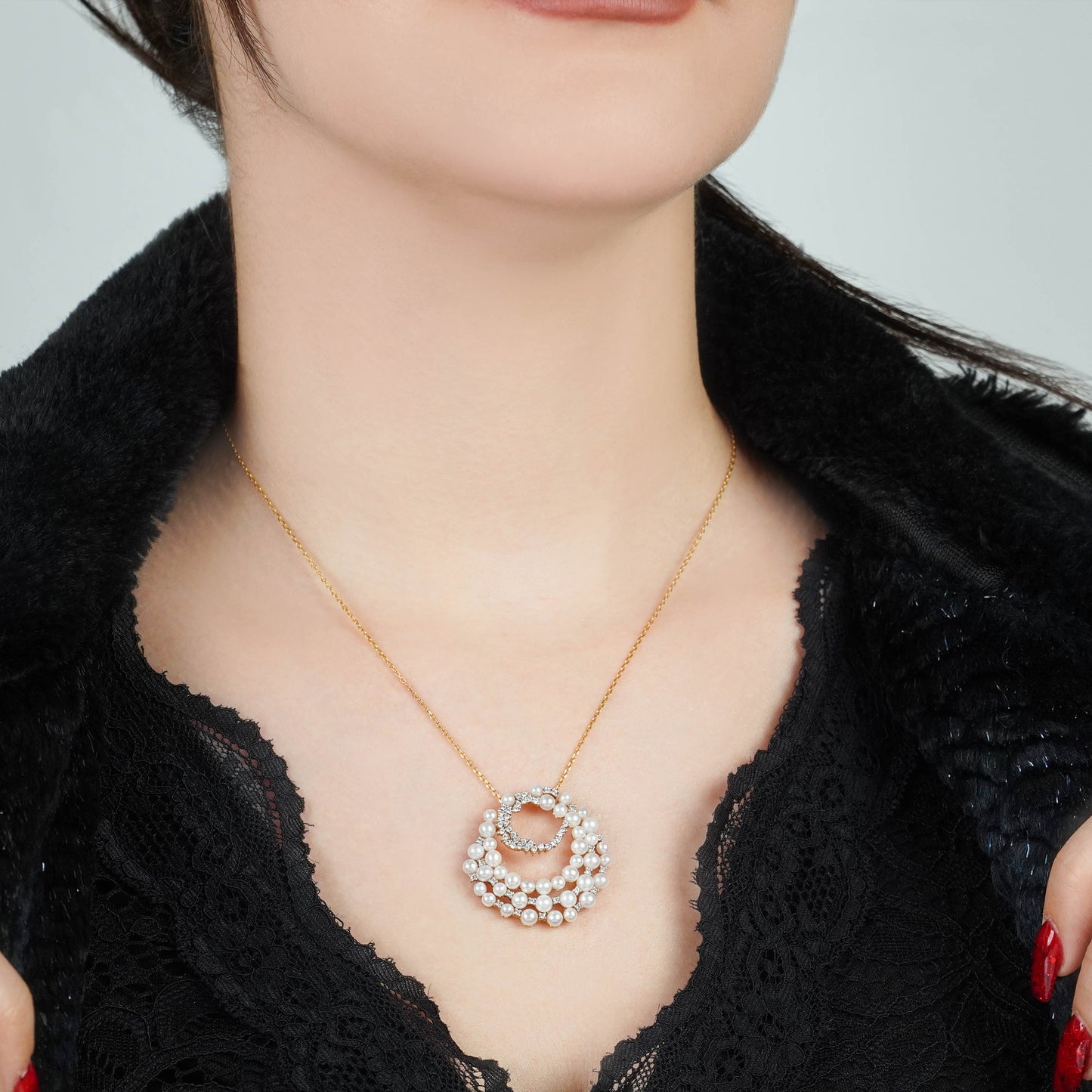 18K yellow gold necklace adorned with lustrous pearls and shimmering zircon stones from the Danah Collection