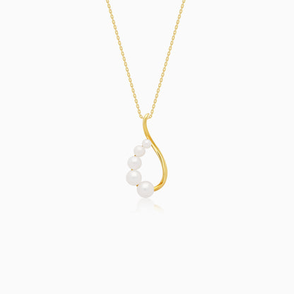 An elegant 18-karat yellow gold necklace adorned with flowing lines of assorted size white pearls