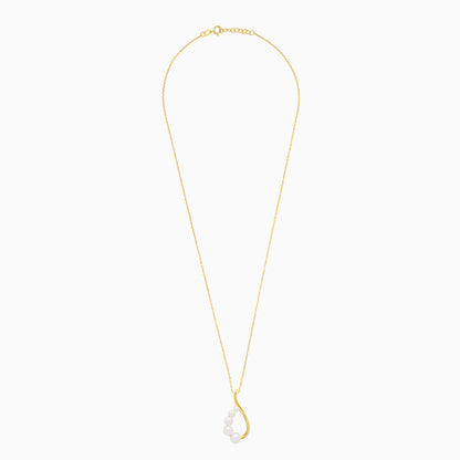 An elegant 18-karat yellow gold necklace adorned with flowing lines of assorted size white pearls
