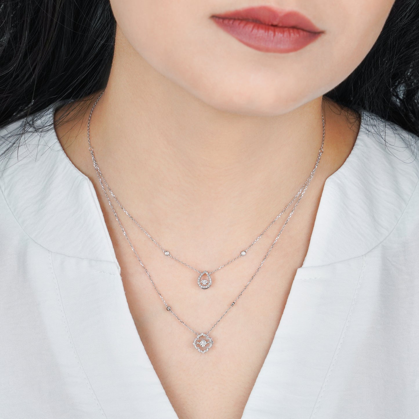 18K White gold Two layer Necklace with drop shaped and flower shaped decorated with natural dancing diamond stones.