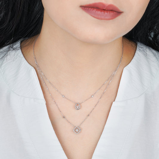 18K White gold Two layer Necklace with drop shaped and flower shaped decorated with natural dancing diamond stones.