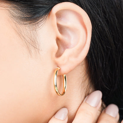 18k yellow gold earrings in round shape