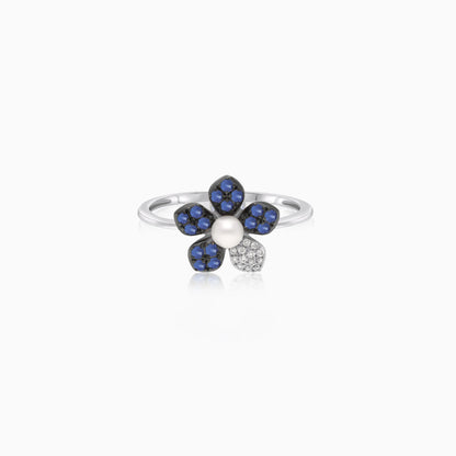 18k white gold ring with a flower shape on the top decorated with natural diamond, Sapphire stones and single pearl in the center