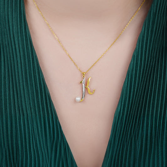 18k yellow gold chain with pendant of letter “k” decorated with natural diamond and pearl