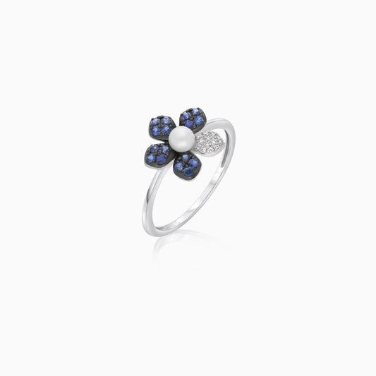 18k white gold ring with a flower shape on the top decorated with natural diamond, Sapphire stones and single pearl in the center