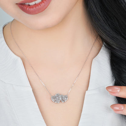 18K WHITE GOLD NECKLACE WITH 2 HEART DECORATED WITH NATURAL DIAMOND TAPERED BAGUETTE SHAPE