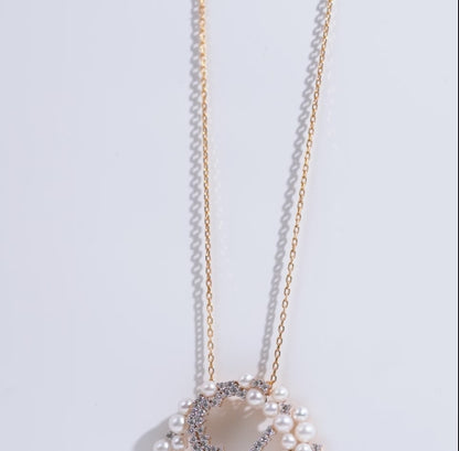 18K yellow gold necklace adorned with lustrous pearls and shimmering zircon stones from the Danah Collection
