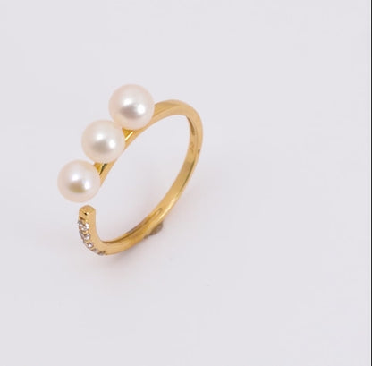 18k yellow gold open ring decorated with pearl and zircon stones
