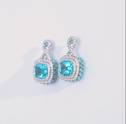 18K White Gold Earring featuring a stunning Natural Diamond and Blue Topaz stones