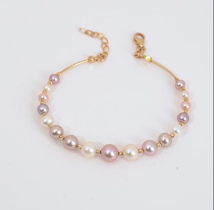18k yellow gold bangle decorated with white and lavender pearls - from Danah Collection