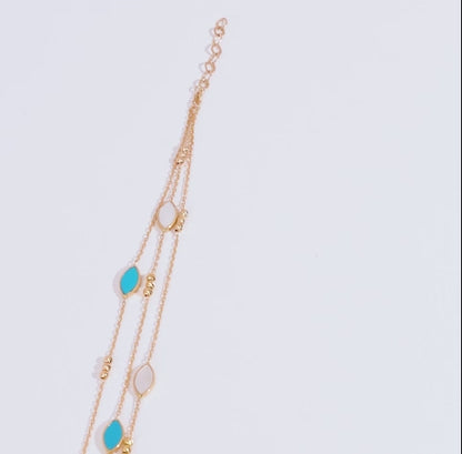 18k yellow gold bracelet three-layer decorated with mother of pearl and turquoise stones