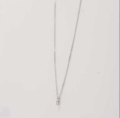 18k white gold chain with a pendant pear shaped natural diamond