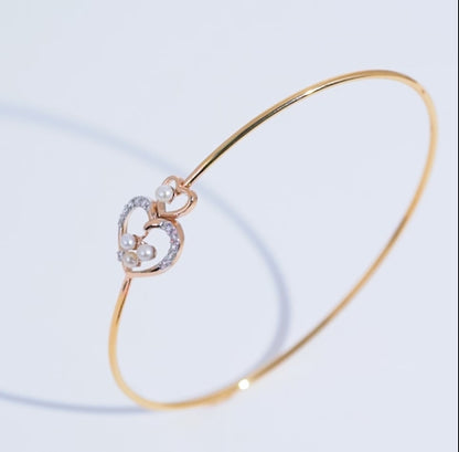 18K Yellow Gold Bangle with Dual Heart Design Adorned with Natural Diamonds and Pearls